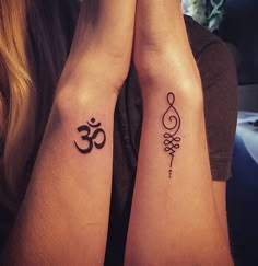 two people with matching tattoos on their arms