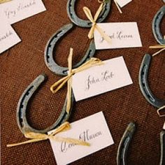 several horseshoes with name tags attached to them