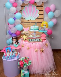 a little mermaid birthday party with balloons, cake and decorations