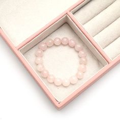 Rose Quartz 10 mm round beaded smooth bracelet, Pink rose quartz bracelet stretchable bracelet, Healing crystal pink quartz bracelet for her Stone: Rose Quartz Size of bead: 10 mm Shape of bead: Round smooth Quality of Stone: AAA+ Type of band: Elastic stretchable *comes with a velvet pouch Description: Embrace the tender beauty of our Rose Quartz Bracelet, a symbol of love and compassion elegantly wrapped around your wrist. Each bead, crafted from genuine rose quartz, exudes a delicate pink hue, radiating soothing energies. Beyond its aesthetic charm, rose quartz is celebrated for its healing properties, believed to open the heart chakra, fostering love, self-compassion, and emotional healing. Wear this bracelet as a daily reminder to cultivate love in all aspects of life, enveloping your Pink Quartz Bracelet, Bracelet For Her, Rose Bracelet, Stone Rose, Pink Rose Quartz, Rose Quartz Bracelet, Velvet Pouch, Quartz Bracelet, Quartz Rose