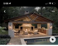 an outdoor living area next to a swimming pool at night with lights on the ceiling