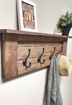 a coat rack and hat hanger on a wall