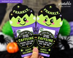 someone is holding up two halloween treat boxes with the words franky and frankie on them