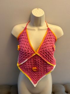 Crocheted bohemian top. One size fits most Spring Festival V-neck Halter Top, Bohemian V-neck Halter Top For Summer, Fitted V-neck Top For Festival, Summer Festival V-neck Halter Top, Bohemian Cotton Crochet V-neck Top, Bohemian V-neck Crop Top For Beach Season, Festival Crochet V-neck Crop Top, Pink Fitted Crochet Top, Handmade Fitted Crochet Top For Festival