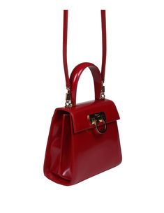 Small top handle in abraded calfskin red gancini closure in golden metal a leather handle two internal compartments one internal zip pocket one back slot pocket removable leather shoulder strap measures: height 19. 0 cm length 20. 5 cm depth 10. 0 cm composition 100% abraded calfskin made in italy Ferragamo Handbags, Chloe Purses, Ferragamo Shoes, Marine Serre, Sneaker Wedge, Yoga Wear, Small Tops, Beautiful Shoes, Manolo Blahnik