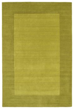 an area rug with a square shape in green