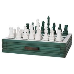 a wooden chess board with white pieces on it