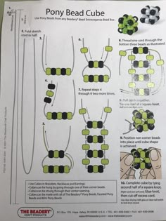 the instructions for pony bead cubes are shown in green and black, on top of a white sheet