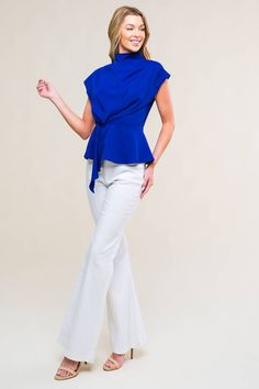 A solid woven top featuring high neckline, pleating detail at shoulder, peplum and back zipper closure 95% Polyester; 5% Spandex Dressy Shirts, Scarf Headband, Woven Top, Dressy Tops, Blue Top, Event Dresses, High Neckline, Scarf Styles, Cute Tops