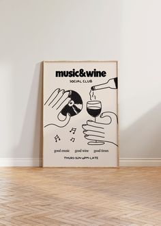 a poster with music and wine written on it next to a wooden floor in front of a white wall