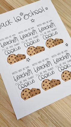 a printable cookie recipe is shown on a table with some chocolate chip cookies in it