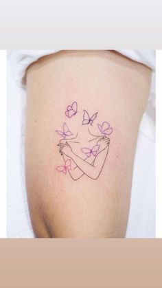 a woman's arm with butterflies and a girl holding a butterfly tattoo on it