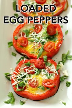 three tomatoes with cheese and herbs on them are sitting on a white platter that says loaded egg peppers