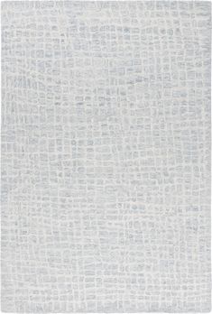 a white rug with grey squares on it