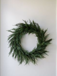 a green wreath hanging on the wall