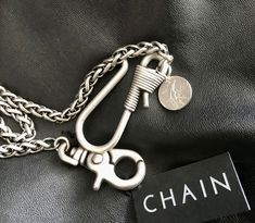 🖤Men's vintage look triple weave Pocket Viper chain in matt silver. Made in Italy (so you know it's quality) from nickel free alloy featuring a unique 5.5cm matt silver hook with 4cm matt silver lobster clasp and vintage 50 Lira coin. Ideal for attaching your wallet or just looking super cool.  Style over fashion....any day! Add a touch of swagger to elevate your suit and keep it edgy or equally perfect for rock, grunge, goth or heavy metal. Whatever style your into, this unique Viper Pocket Chain is a cool addition to your jeans.  Only 2 available in this particular model. These unique chains just arrived direct from Italy and you will find no others like these on Etsy,  so be quick.🖤 If you have any questions feel free to reach out.🖤 Chain For Jeans, Pants Chain, Cool Pants, Pocket Chain, Pant Chains, Crochet Unique, Grunge Goth, Chain Belt, Thumb Rings