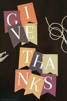 several pieces of paper with the words give thanks written on them and scissors next to it