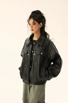 Experience the perfect blend of attitude and comfort with our Oversized Faux Leather Jacket, featuring a unique star pendant zip detail.
Crafted from smooth faux leather, this jacket exudes a moody vibe with its street-inspired silhouette and multiple pockets for practicality. The distinct star-shaped zippers add a playful twist to the jacket's design, making it a standout piece in your wardrobe. With a relaxed oversized fit, it offers ample space for layering over your favorite outfits while pr Edgy Leather Jacket With Asymmetrical Zip For Streetwear, Edgy Asymmetrical Zip Leather Jacket For Streetwear, Baggy Leather Jacket, Star Leather Jacket, Retro Biker Style, Winter Grunge Leather Outerwear, Black Leather Punk Outerwear, Rocker Look, Look Rock