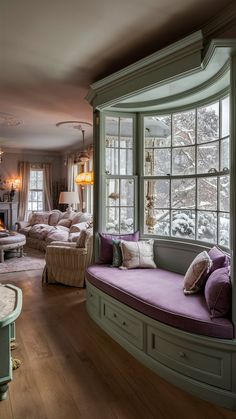 a living room filled with lots of furniture next to a window covered in windowsills