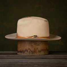 The Wazee is the latest style in our NINE7O Collection. The Wazee is a hat made for uptown, downtown, ranch life, and everything in between. This new take on a classic fedora with some distressing and leather detail is sure to become your go-to hat! The Wazee Details: Buckskin Fashion Weight 6" Tapered Crown 3" Brim Width Keenland Crown Shape Soft Snap Brim Flex Fit Sweatband Mild Distressing Tandy Leather cording with a safety pin accent No Liner Note: This is a Unisex style. If you are not sur Fitted Panama Hat For Western-themed Events, Vintage Fitted Fedora For Ranch, Fitted Vintage Fedora For Ranch, Fitted Fedora For Ranch Events At Kentucky Derby, Western Style Brimmed Panama Hat In Fur Felt, Western Style Brimmed Fur Felt Panama Hat, Vintage Brimmed Fedora For Ranch, Fitted Fedora With Flat Brim For Ranch, Fedora Top Hat For Kentucky Derby