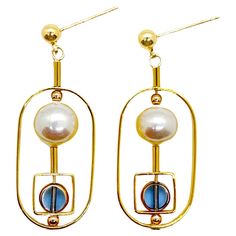 The earrings are lightweight and are made to rotate and reposition with movement. Small blue circle vintage German glass beads edged with 24K gold are complimented with freshwater pearls. The earrings are finished with gold-filled earring posts and gold-filled beads. The vintage German glass beads that are edged with 24K gold were hand-pressed during the 1920s- 1960s. No two beads are exactly alike. These beads are no longer in production thus making them rare and highly collectible. Product Det Handmade Modern Gold Pearl Earrings, Handmade Gold Modern Pearl Earrings, Beads Art, Blue Circle, Earring Posts, Bead Art, Vintage Stil, Post Earrings, Freshwater Pearls