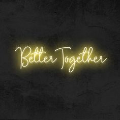 a neon sign that says better together in white lettering on a black wall with the word below it