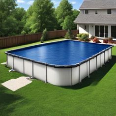 an above ground swimming pool surrounded by grass