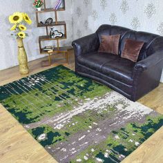 a living room with a couch, chair and rug