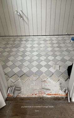 a bathroom that is being remodeled with tile on the floor