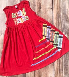 "PLEASE NOTE: I CANNOT GUARANTEE DELIVERY DATES, ONLY SHIPPING DATES. USPS has had some delays lately. If you are close to the day you need it, you may consider going up to priority mail at checkout. Great back to school dress! This dress features a row of cute crayons with ricrac writing in fun fabric and your child's initial at the top. A full name is available for an additional fee. The letters will be sized to fit the dress. Applique are hand-cut, fused on the dress then top-stitched for dur Kindergarten Outfit, Back To School Dress, Dress Applique, Back To School Outfit, Fun Fabric, School Dress, Girl's Back, School Dresses, Dress Measurements