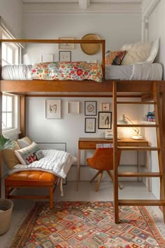 a loft bed with a desk underneath it and a chair in front of the bed