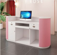 a desk with a computer on top of it