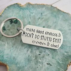 Silver Keychain that is handstamped to read Make good choices & Don't do stupid shit <3 mom & dad Keychain Sayings, Dad Keychain, Sweet 16 Gifts, Keychain Cute, Hand Stamped Keychain, Cute Car Accessories, Make Good Choices, Birthday Idea, Love Mom