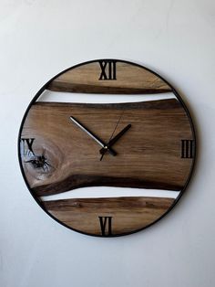 a clock made out of wood with roman numerals