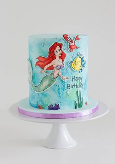 the little mermaid birthday cake is decorated with fondant