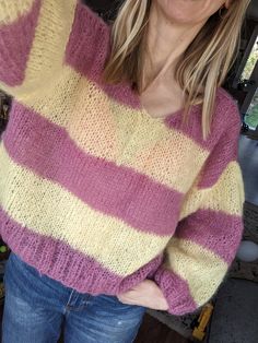 Imagine slipping into a jumper that feels like a warm hug, made just for you. This pink and yellow jumper is crafted in a relaxed fit, perfect for those who love a cosy, unique piece. Each jumper is lovingly handmade right here in the UK, with designs that are as unique as you are--no two are ever the same. I create every piece using sustainably sourced yarn, including end-of-line mohair and leftover bits from other makers, turning what might have been wasted into something beautiful. This means Yellow Jumper, Winter Jumpers, Sweater Gift, Ethical Clothing, Dream Design, Pullover Sweater Women, Handmade Knitting, Women Pullover, Pullover Sweaters