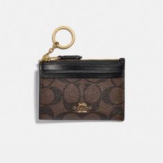 Coach Mini Skinny Id Case In Signature Canvas Color: Gold/Brown Black Signature Coated Canvas And Smooth Leather Two Credit Card Slots Id Window Zip-Top Closure, Fabric Lining Attached Split Key Ring 4 1/4" (L) X 3" (H) X 1/2" (W)