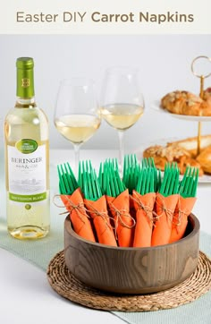 there are carrots in a bowl with green toothpicks next to wine glasses