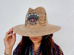 I love Mexico celebrates the native crafts of Mexico and the artists that produce them, enabling them and their communities to get recognized for their talented work and achieve economic stability for their families. This listing is for one piece of this beautiful handmade straw hats. They are prefect to add to your closet for your favorite dress, providing shade from the warm summer sun. The eye decoration is hand embroidered. Consist of decorative gems. You will get the exact same piece shown Artisan Handwoven Summer Straw Hat, Embroidered Straw Hat For Beach With Short Brim, Traditional Woven Straw Hat For Spring, Handmade Flat Brim Toquilla Straw Hat, Artisan Handwoven Summer Hats, Toquilla Straw Flat Brim Hat For Festivals, Flat Brim Toquilla Straw Hat For Festivals, Traditional Fedora Panama Hat For Summer, Artisan Straw Hat For Summer Rodeo