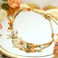 Orange Blossom Bracelet is a unique bracelet among nature jewelry on Selenichast online shop. It’s pretty and charming on the wraist. Its enamel paint combined with a 18k gold chain looks so elegant. Spring Bangle Jewelry Gift, Charming Adjustable Jewelry For Wedding, Spring Gift Bangle Jewelry, Enamel Jewelry For Spring Gifts, Gold Vintage Jewelry For Spring, Elegant Adjustable Enamel Jewelry, Spring Enamel Jewelry For Gifts, Spring Enamel Jewelry As Gift, Spring Vintage Gold Jewelry