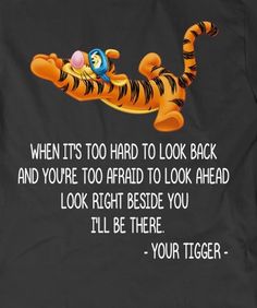 a black t - shirt with winnie the pooh on it and an image of tigger