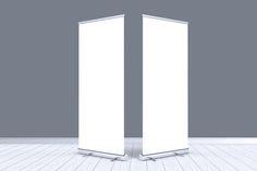 two tall white displays in an empty room