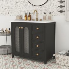 a bathroom with a sink, mirror and black cabinet