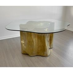 a glass table with gold leaf design on it