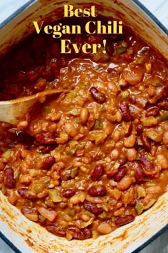 a pot filled with beans and sauce on top of a table