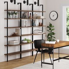 a room with a table, bookshelf and clock on the wall