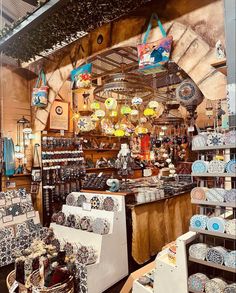 a store filled with lots of different types of pottery