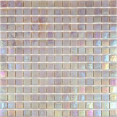 a close up view of a glass mosaic tile backsplash that looks like it has iridescent colors