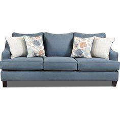 a blue couch with four pillows on it