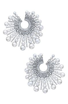 Lustrous spokes of Akoya pearls fan out from the radiant center of these 18-karat white-gold earrings illuminated by 332 round diamonds. 1 5/8" drop   Total diamond weight: 4.75ct.   Color: G-H   Clarity: VS   18k gold/Akoya cultured pearl/diamond   Made in the USA   >Diamond Guide Evening Diamond Pearl Earrings For Pierced Ears, Luxury Pearl Embellished Earrings For Evening, Luxury Pearl Earrings With Diamond Accents, Luxury White Diamond And Akoya Pearl Earrings, Luxury Akoya Pearl Drop Diamond Earrings, Luxury Pearl Diamond Earrings In White, Luxury Round Akoya Pearl Diamond Earrings, Luxury Pear-shaped Akoya Pearl Earrings, Pearl Anniversary